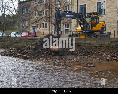 Clearing stones and debris from the floor of the River Calder in Hebden Bridge.  Part of an effort to prevent further flooding. Stock Photo