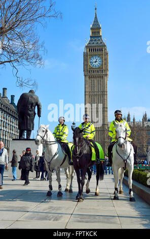 London, England, UK. Mounted police officers in Parliament Square, Westminster - Big Ben behind Stock Photo