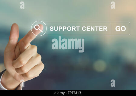 business hand clicking support center button on search toolbar with vintage style effect Stock Photo