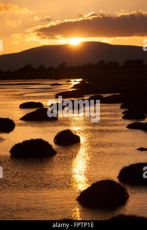 Solway Firth, Scotland. Picturesque view of sunset over the Solway Firth saltmarsh and beach, near the village of Powfoot. Stock Photo