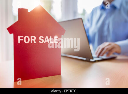 Searching the internet for real estate or new house Stock Photo