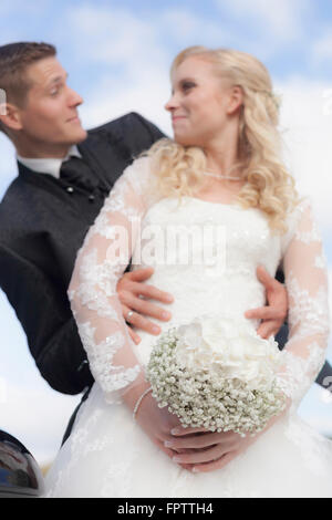 Bride and groom doing romance, Ammersee, Upper Bavaria, Bavaria, Germany Stock Photo