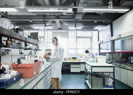 Male scientists working in a pharmacy laboratory, Freiburg Im Breisgau, Baden-Württemberg, Germany Stock Photo
