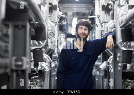 Young male engineer working in an industrial plant, Freiburg Im Breisgau, Baden-Württemberg, Germany Stock Photo