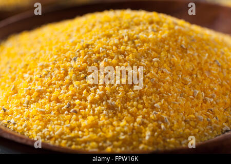 Raw Organic Polenta Corn Meal in a Bowl Stock Photo
