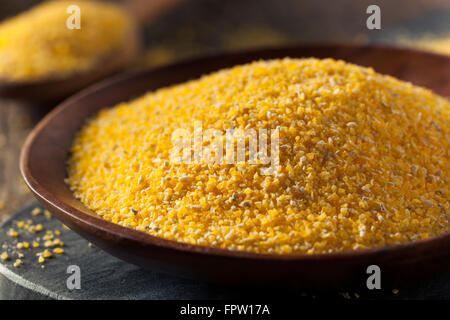 Raw Organic Polenta Corn Meal in a Bowl Stock Photo