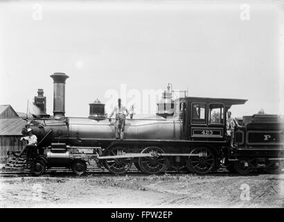 1900s THREE MEN WORKERS STANDING ON TRAIN STEAM ENGINE Stock Photo