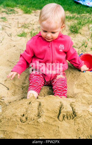 Toddler playing in the sand, Germany Stock Photo