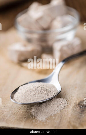 Yeast (fresh and dried)on vintage wooden background (close-up shot) Stock Photo