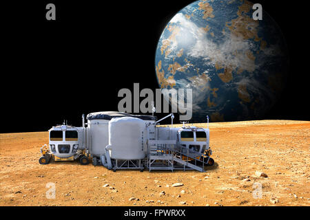 An artist's depiction of a lunar base on a barren moon. The moon's Earth-like planet rises in the background. The small colony i Stock Photo