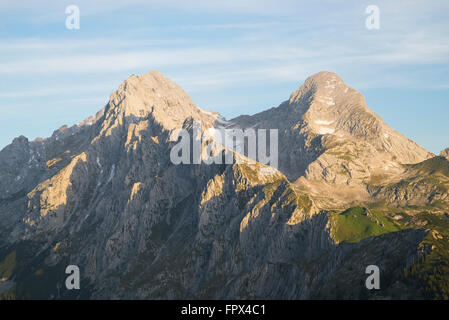 Mount Alpspitze and Mount Hochblassen in the Wetterstein mountain range near Garmisch-Partenkirchen illuminated at sunrise Stock Photo