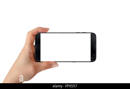 Modern black smart phone in woman hand in horizontal position. White screen for mockup, isolated. Stock Photo