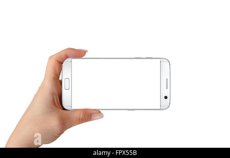 Modern white smart phone in woman hand in horizontal position. White screen for mockup, isolated. Stock Photo