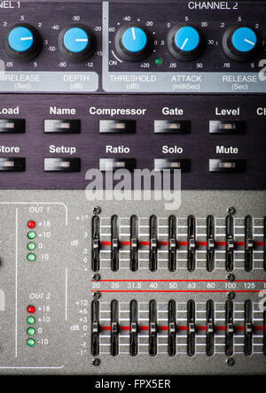 Color image of many buttons on a sound mixer in a recording studio. Stock Photo