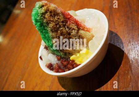 Ais Kacang (ABC), a colorful Malaysian dessert made of shaved ice, beans and colored jelly Stock Photo