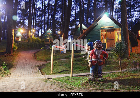 Wooden cottages in the middle of forest Stock Photo