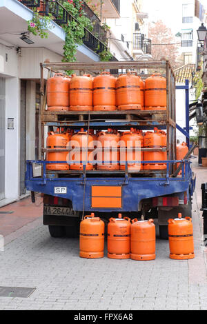 Gas bottles delivery service truck in a village in Spain. Stock Photo