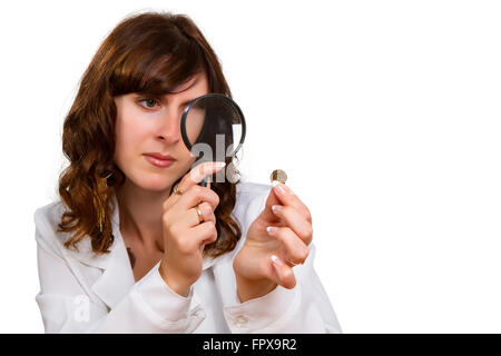 Financial concept, hand hold magnifying glass and coins Stock Photo