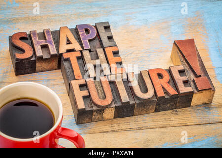 Shape the future - motivational phrase in vintage letterpress wood type blocks stained by color inks Stock Photo