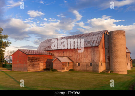 Colour landscape image showing traditional wood barn on a farm in Southwestern Ontario, Canada. Stock Photo