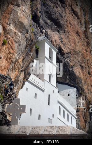 built in to a sheer rock face is the holiest place for Orthodox Christians in Montenegro; the Ostrog Monastery Stock Photo