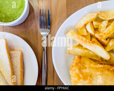 Fish chips  mushy peas and white bread and butter traditional Yorkshire food Stock Photo