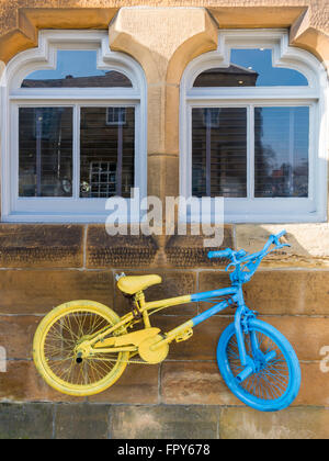 Tour de  Yorkshire cycle race 2016 promoted using yellow and blue painted bicycles here at Stokesley North Yorkshire Stock Photo