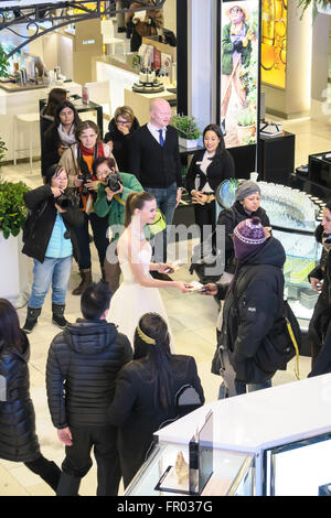 New York, USA. 20th March, 2016. Macy's transcontinental journey in flowers draws crowds. A wedding dress model graced the main floor. Credit:  Patti McConville/Alamy Live News Stock Photo