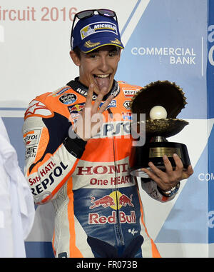 Doha, Qatar. 20th Mar, 2016. Spanish MotoGP rider Marc Marquez of the Repsol Honda Team holds his trophy on the awarding podium after winning the third place during the final race of Qatar Grand Prix at the Losail international circuit in Doha, Qatar, March 20, 2016. Credit:  Nikku/Xinhua/Alamy Live News Stock Photo