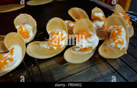 Khanom Beaung Thai or a kind of filled pancake Thai food or Thai Style Crisp Tart on tray, Thailand - (Selective focus) Stock Photo