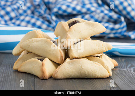 On Purim, Ashkenazi Jews eat triangular pastries called Hamantaschen (Haman's pockets) or Oznei Haman (Haman's ears) Stock Photo