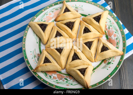 On Purim, Ashkenazi Jews eat triangular pastries called Hamantaschen (Haman's pockets) or Oznei Haman (Haman's ears) Stock Photo