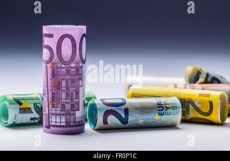 Several hundred euro banknotes stacked by value.Rolls Euro banknotes.Euro currency money.Announced cancellation of five hundred Stock Photo