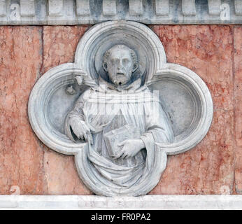 Saint Dominic by Paolo di Bonaiuto relief on facade of the San Petronio Basilica in Bologna, Italy, on June 04, 2015 Stock Photo