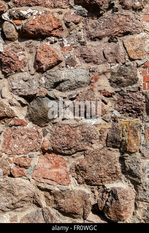 Rough natural old stone wall as background Stock Photo