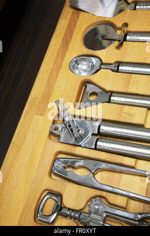 Brilliant kitchen tools on a wooden support Stock Photo