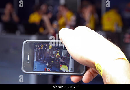 KYIV, UKRAINE - MAY 19, 2012: Visitors take a photos of Red Bull RB7 racing car during Red Bull Champions Parade on the streets of Kyiv city Stock Photo