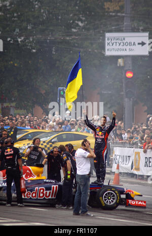 Red Bull driver Daniel Ricciardo, of Australia, pulls his helmet on ...