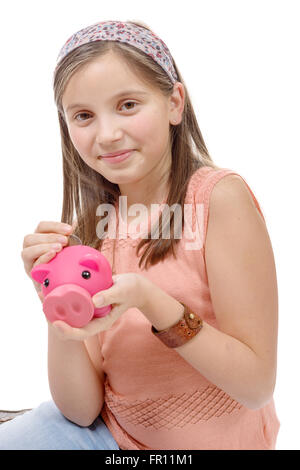 a preteen with a piggy bank, on white Stock Photo