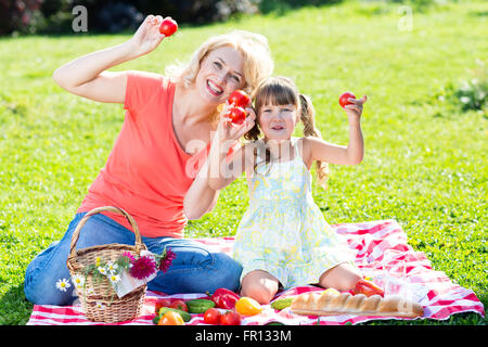 Family having picnic in summer park Stock Photo