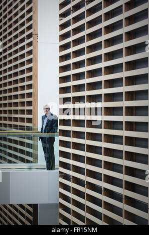 Portrait senior businessman on walkway in modern office Stock Photo