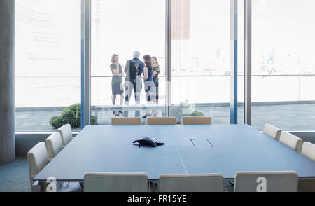 Business people talking on conference room balcony Stock Photo