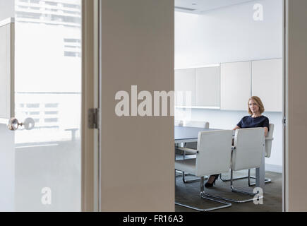 Portrait businesswoman waiting in conference room Stock Photo