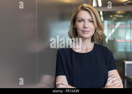 Portrait senior businesswoman with arms crossed Stock Photo