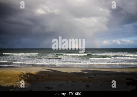 Double rainbow over Kuri Bush Beach - Otago, New Zealand Stock Photo