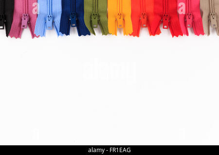 Colorful zippers in different colors on white background. Stock Photo