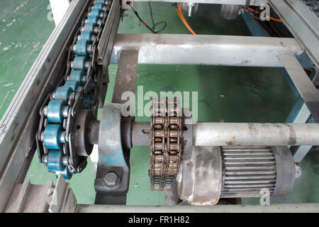 Motor and chain drive shaft Line Conveyor Industrial Stock Photo