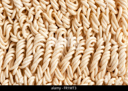 Instant dried ramen noodles suitable for use as a background Stock Photo