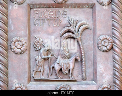 Flight to Egypt on the San Ranieri gate of the Cathedral St. Mary of the Assumption in Pisa, Italy Stock Photo