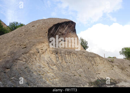 Hollowed out boulder, tafoni, tafone limestone rock formation at Natural park of Ardales and El Chorro, mountain range, Andalusia, Spain. Stock Photo